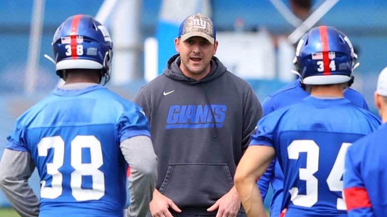 Head Coach Joe Judge of the  Giants looks on during...