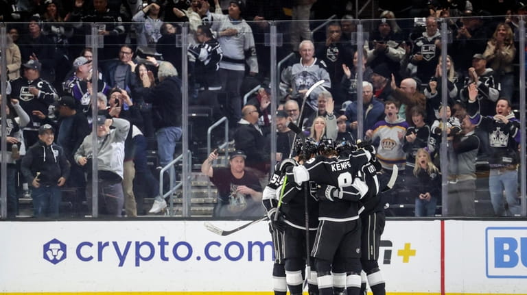 Members of the Los Angeles Kings celebrate after center Trevor...