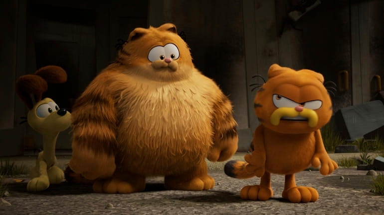 This image released by Sony Pictures shows characters Odie, voiced...