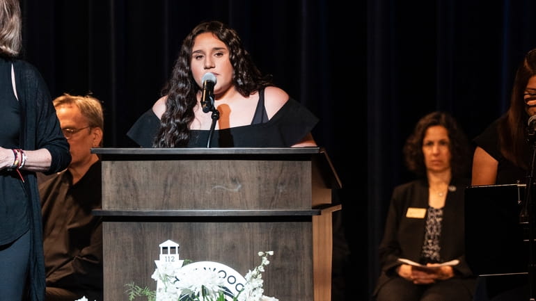 Sophia Mendez delivers a poem during a Remembrance Ceremony for...