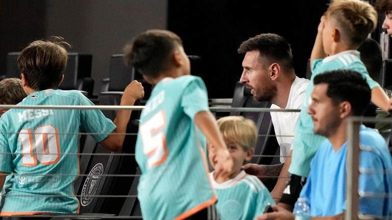 Inter Miami forward Lionel Messi, second from top right, watches...