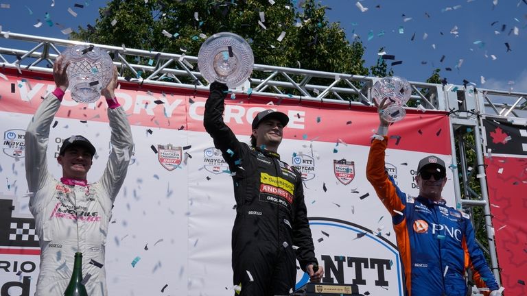 Winner Colton Herta, center, of the United States, second-place Kyle...