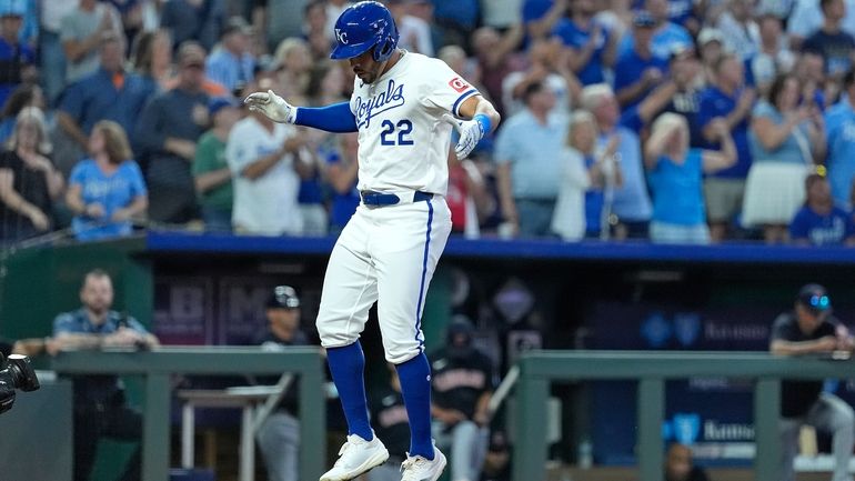 Kansas City Royals' Tommy Pham (22) celebrates as he crosses...