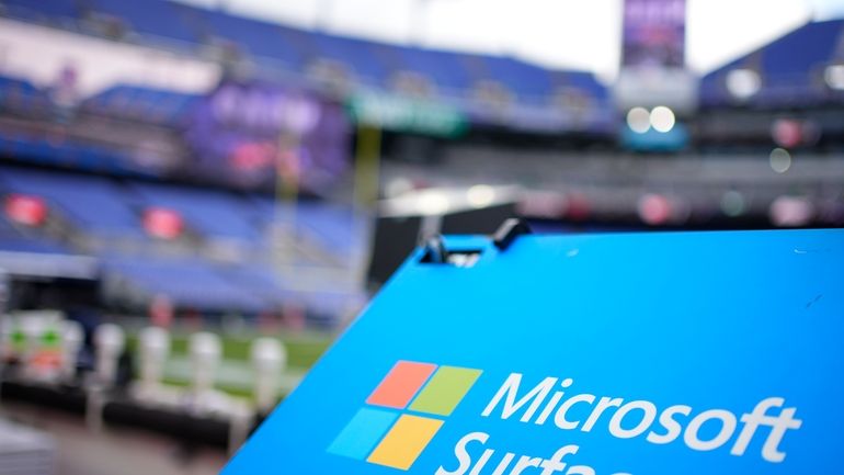 File - A Microsoft Surface logo is seen before an...