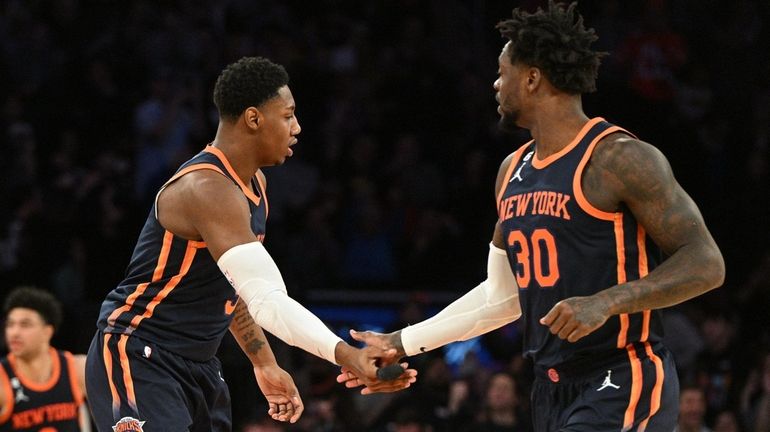 Knicks guard RJ Barrett and forward Julius Randle slap five...