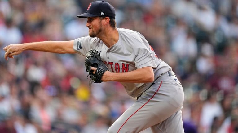 Boston Red Sox starting pitcher Cooper Criswell works against the...