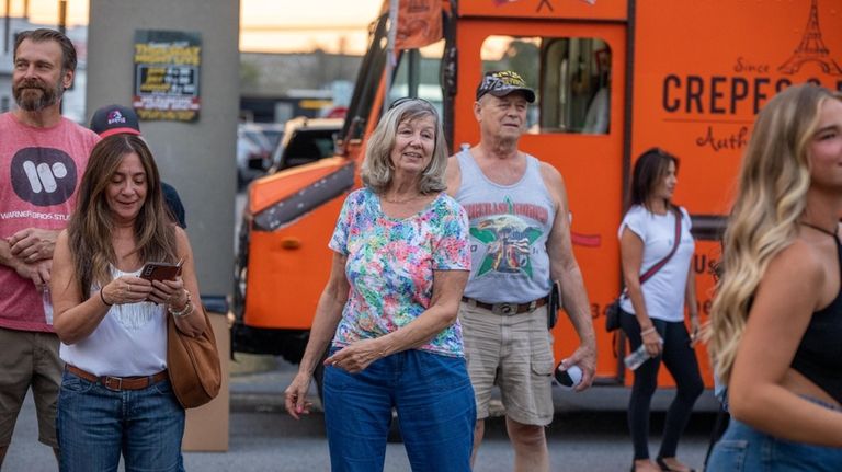 Marylou Peterkin, of Wantagh, dances to music at Thursday Night...