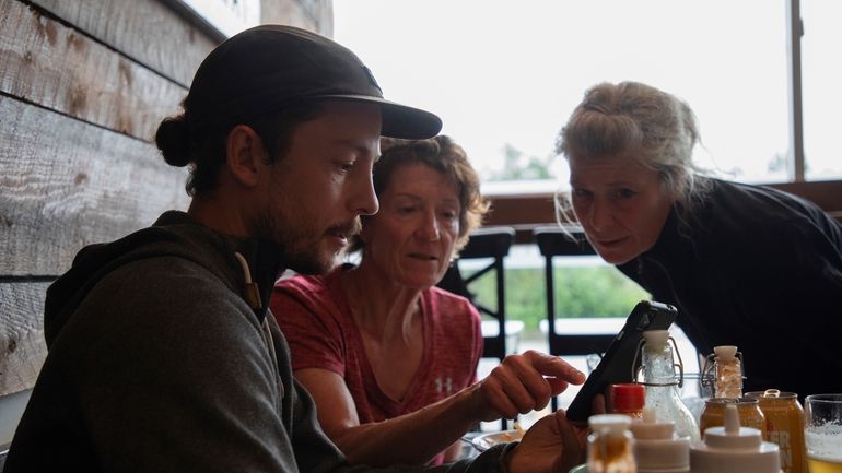 Jasper wildfire evacuees, from left, Jeremie Rodger, Loni Klettl and...