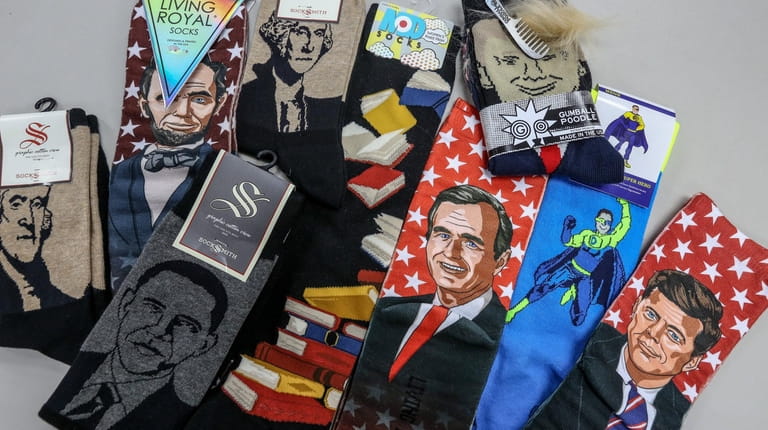 Examples of presidential socks, including those honoring former President Bush, as...