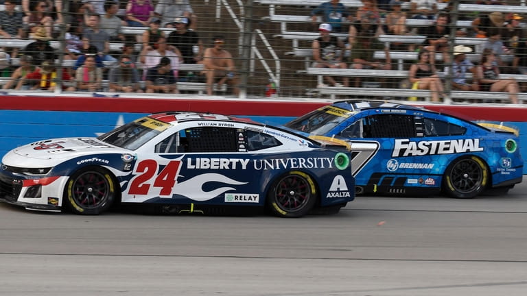 William Byron (24) passes Corey LaJoie race during the NASCAR...