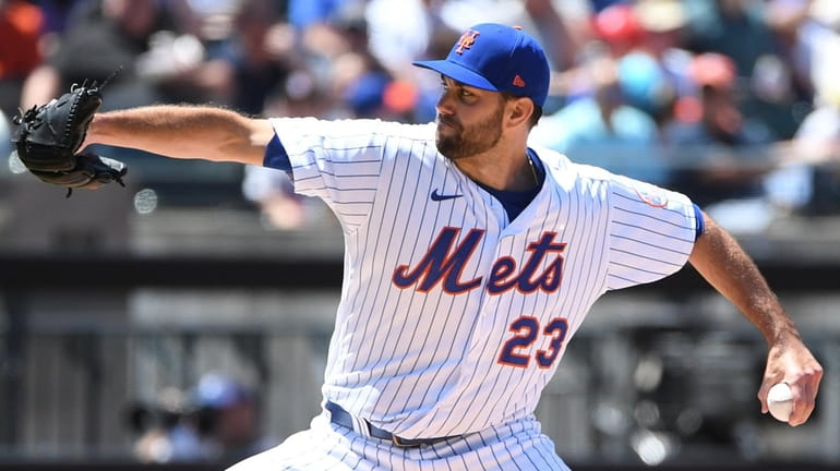 New York Mets starting pitcher David Peterson delivers against the...