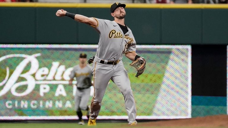 Pittsburgh Pirates third baseman Jared Triolo throws out Cincinnati Reds'...