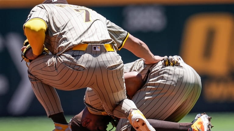 San Diego Padres second baseman Xander Bogaerts (2) kneels after...
