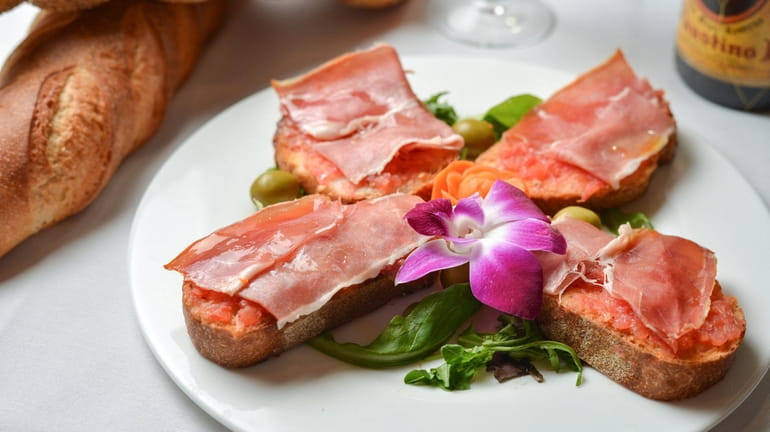 Pan tumaca (tomato-rubbed bread) topped with Spanish ham at Sangria...