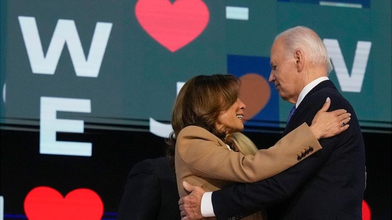 President Joe Biden embraces Democratic presidential nominee Vice President Kamala...