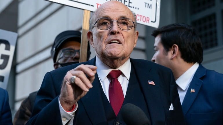 Rudy Giuliani speaks during a news conference outside federal court...
