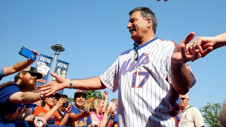 Keith Hernandez  greets the fans as he walks the red...