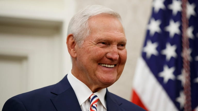 Former NBA basketball player and general manager Jerry West smiles...