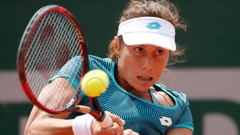 Varvara Lepchenko plays a shot against China's Zhang Shuai during...