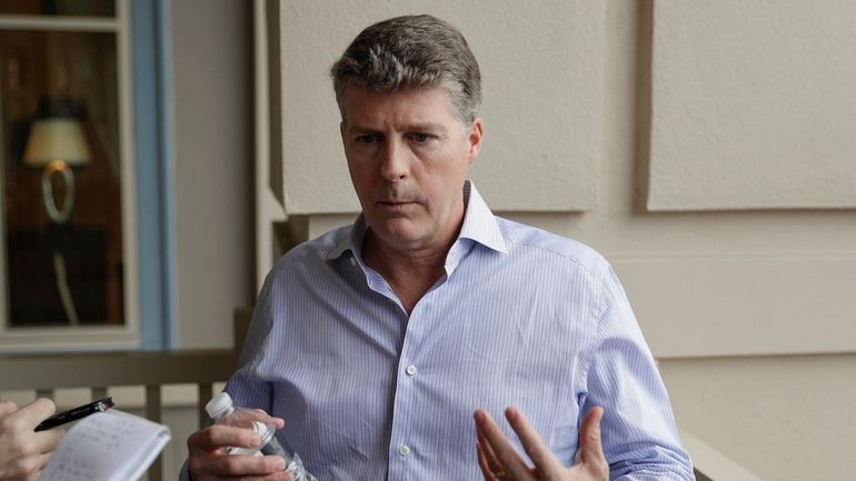 Yankees managing general partner Hal Steinbrenner talks with reporters during...