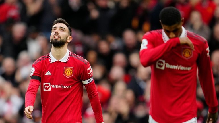 Manchester United's Bruno Fernandes, left, and Manchester United's Marcus Rashford...