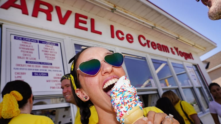 Rebecca Dombrowski, of Huntington, enjoys an ice cream cone at...