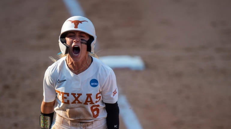Texas' Bella Dayton celebrates after a home run against Texas...