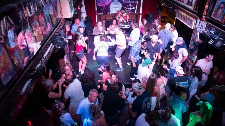 Captain Nick's, a two-floor, indoor-outdoor bar, hosts themed night and live...