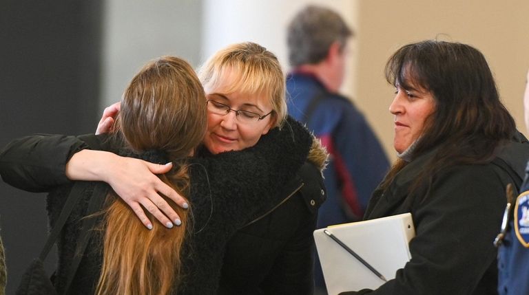 Justyna Zubko-Valva, mother of Thomas Valva, is greeted by supporters...