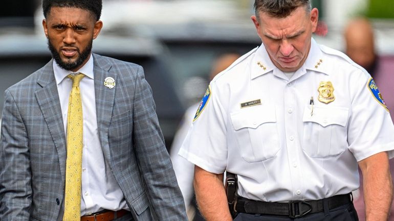 Baltimore Mayor Brandon Scott, left, and Baltimore Deputy Police Commissioner...