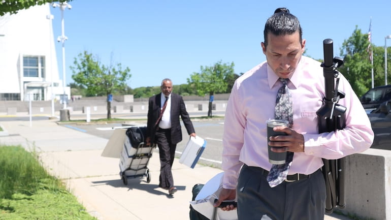 Brian Garcia leaves federal court in Central Islip on Wednesday followed...