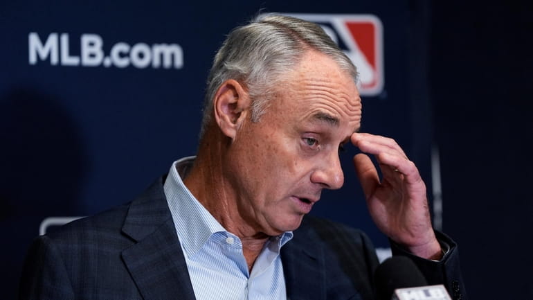 Major League Baseball commissioner Rob Manfred speaks at a news...
