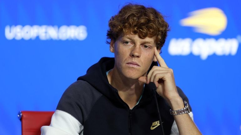 Jannik Sinner speaks to the media during a press conference...