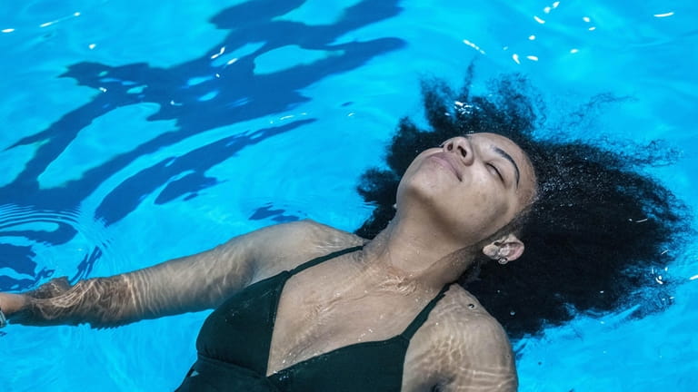 Freeport resident Alyssa Hernandez, 18, relaxing in the cool water...