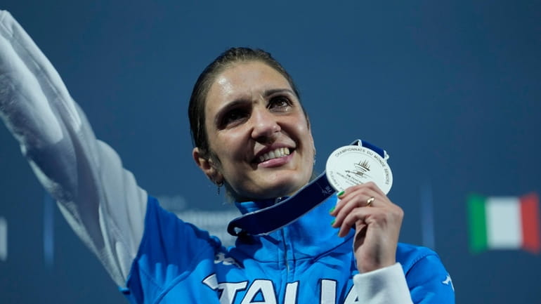 Italy's Arianna Errigo celebrates on the podium her silver medal...