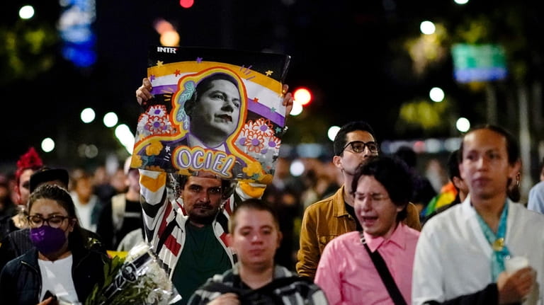 Demonstrators march during a protest seeking justice over the death...