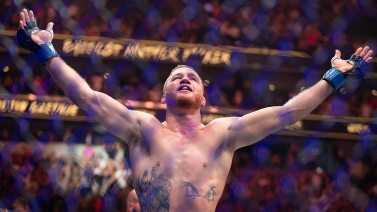 Justin Gaethje celebrates beating Dustin Poirier during their BMF Title...