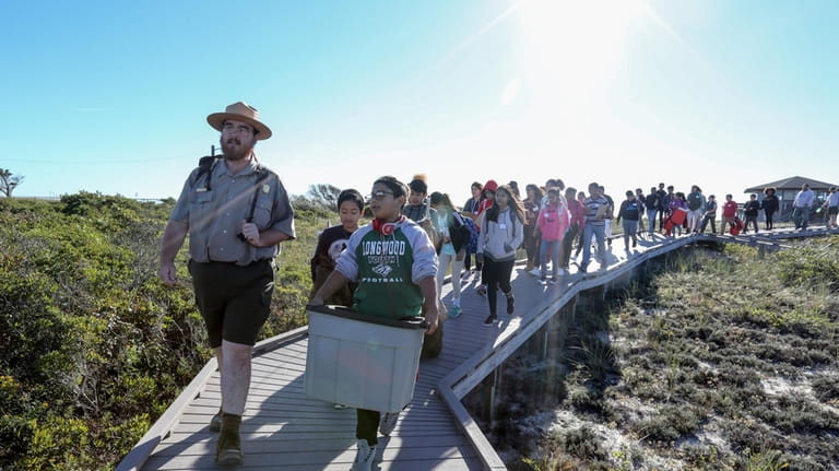 Ranger Kelsey Sucena leads a group of students from Longwood...