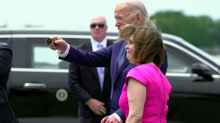 President Joe Biden greets Rep. Kathy Castor, D-Fla., as he...