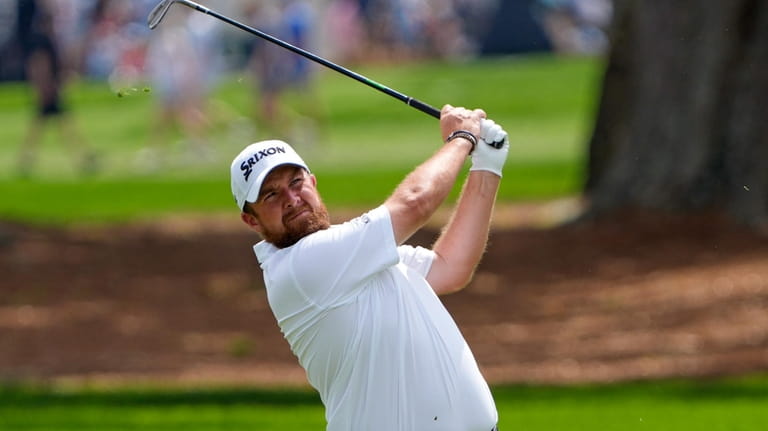 Shane Lowry, of Ireland, hits a shot from the first...