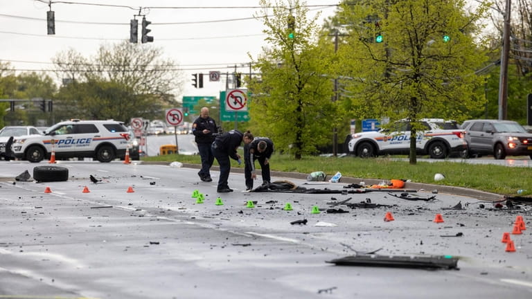 Nassau police investigate the scene of the fatal crash on N. Broadway on...