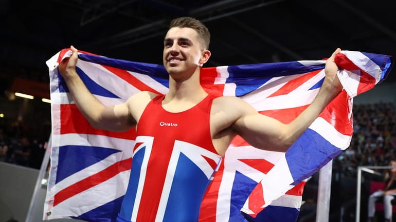 Max Whitlock of Great Britain celebrates winning the gold medal...