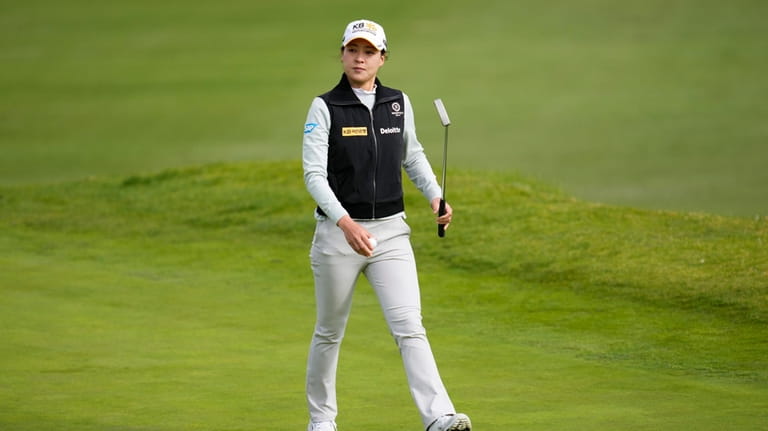 In Gee Chun walks on the 18th green during the...