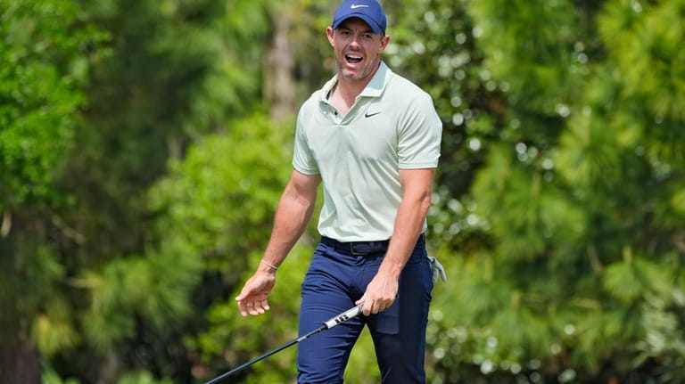 Rory McIlroy, of Northern Ireland, reacts on the second green...