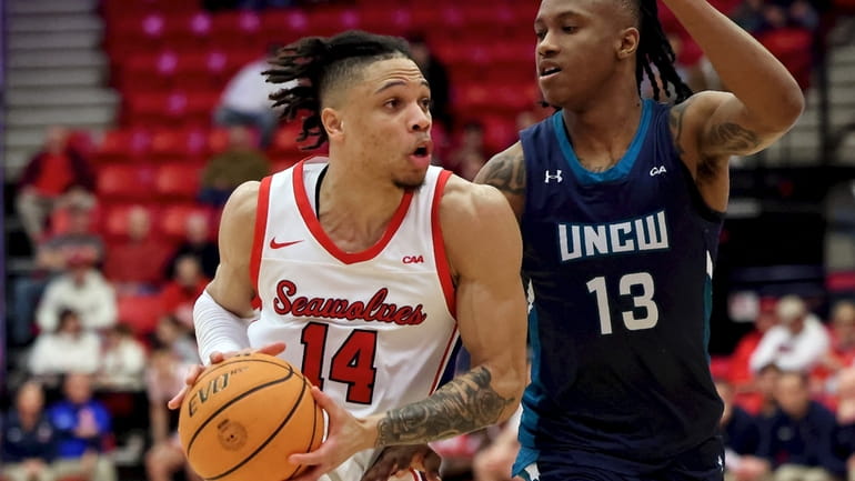 Stony Brook guard Tyler Stephenson-Moore drives the lane against UNCW...