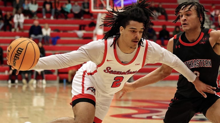 Stony Brook forward Frankie Policelli drives the outside against Northeastern...