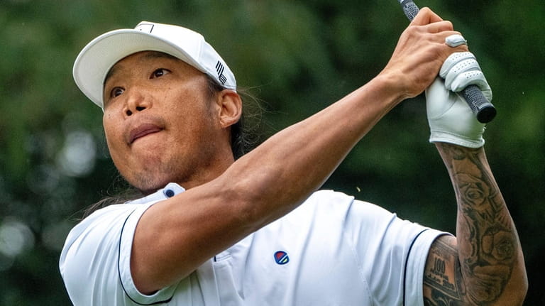 Wild Card player, Anthony Kim hits his shot from the...