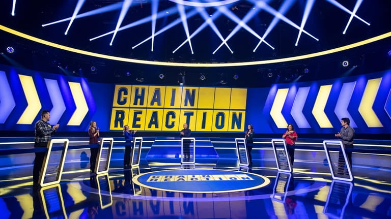Dylan Lane, centers, hosts Game Show Network's popular series "Chain...